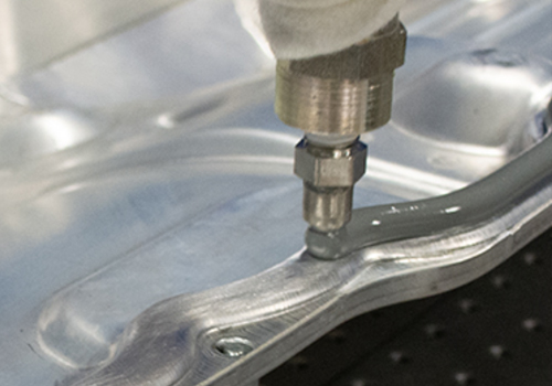 Image showing a robotic application of a sealant or gasketing material