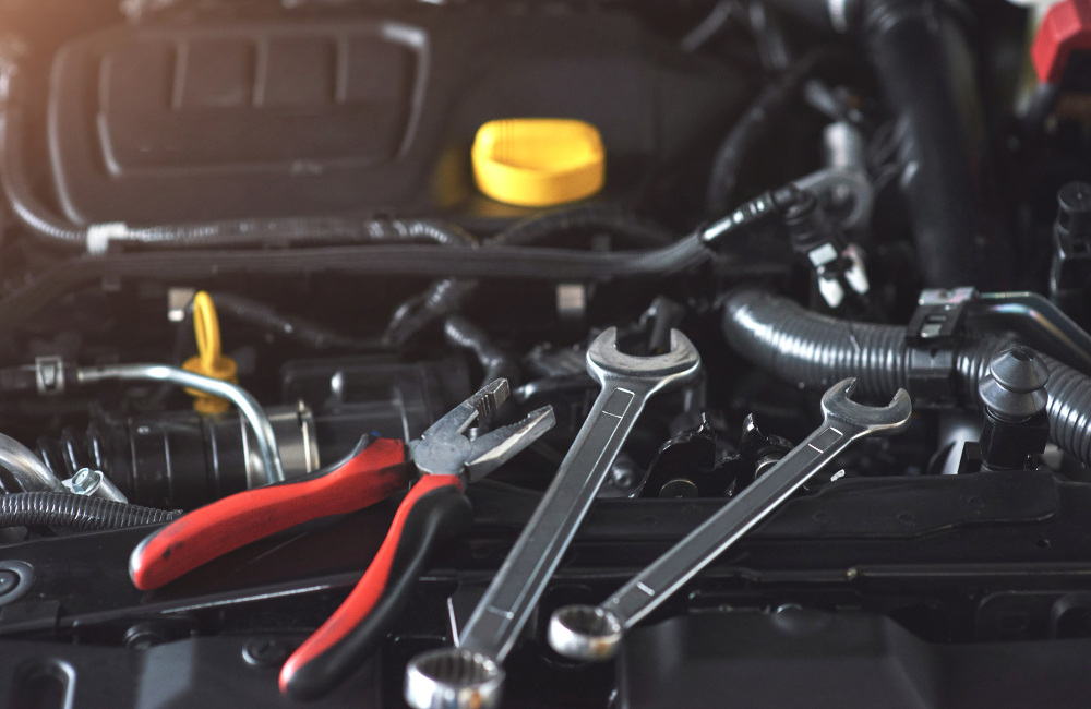 Engine components with wrenches and pliers for maintenance