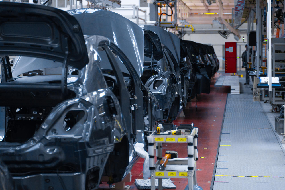 Car body assembly line with industrial equipment and machinery